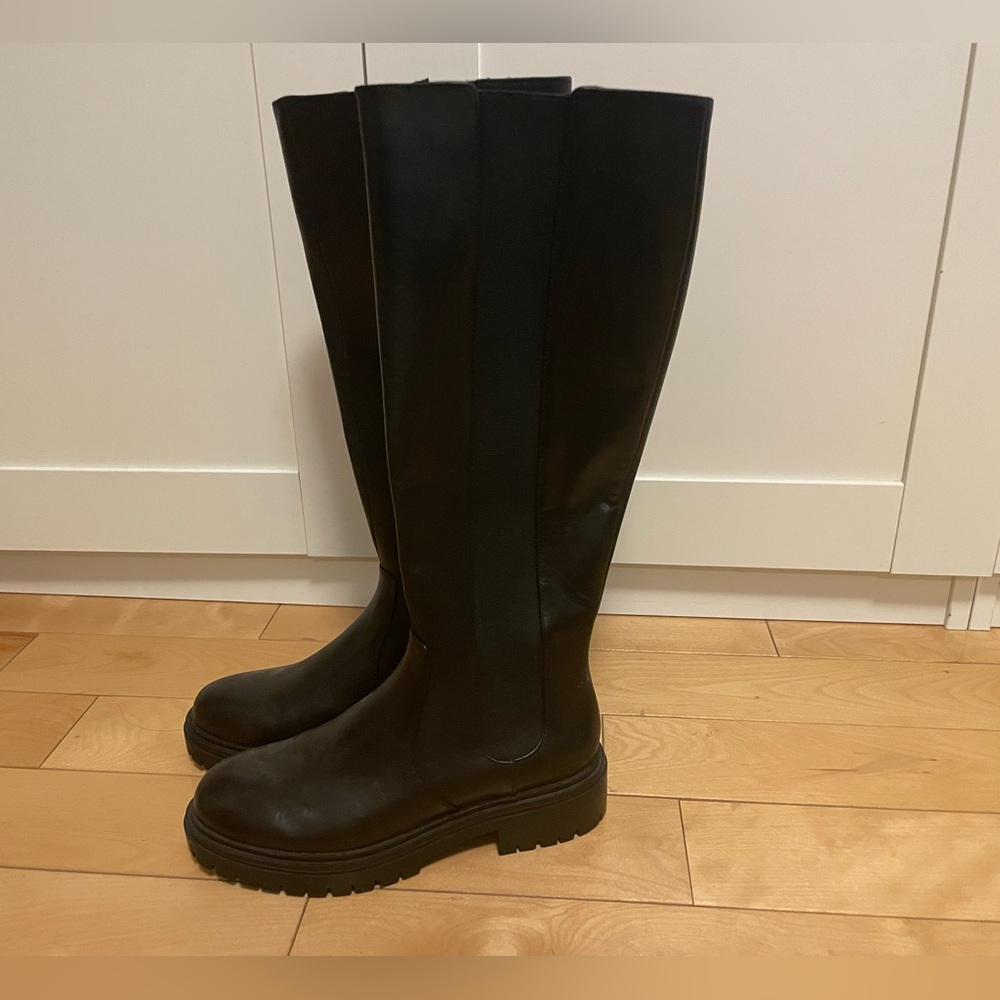 Brand new high black boots. Zip side